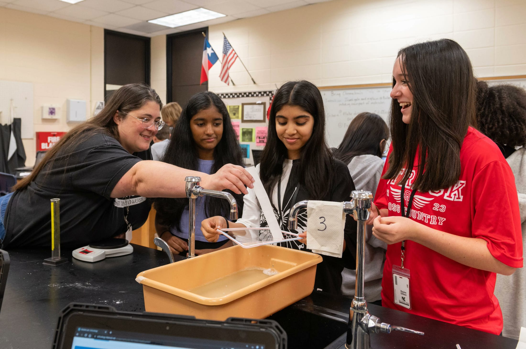 students performing an experiment 