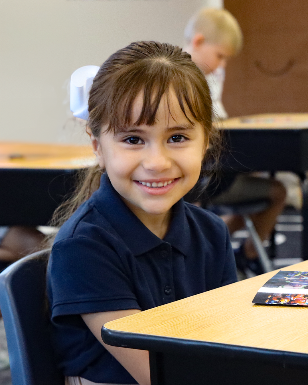 A girl sitting at a desk