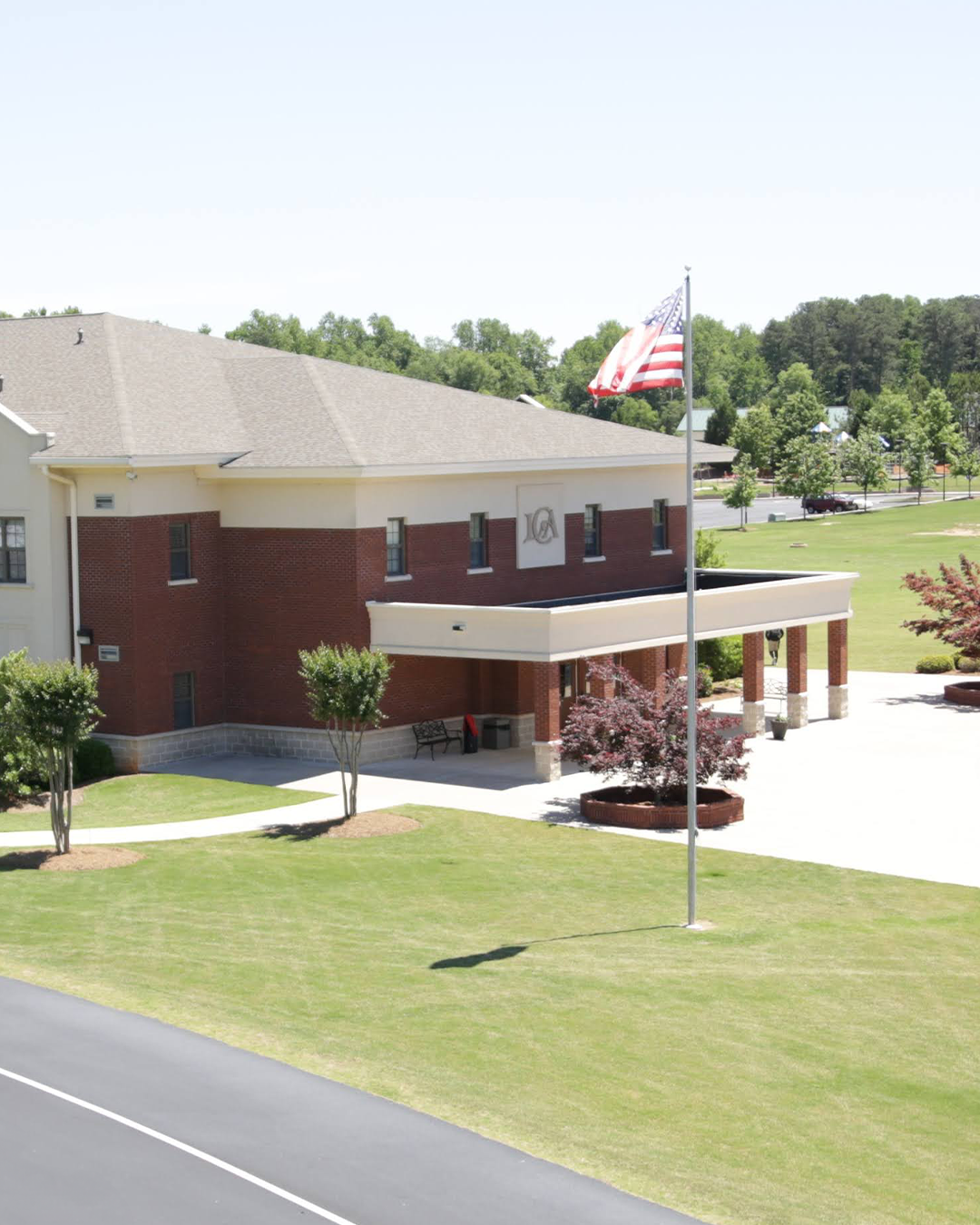 School building with flag in front