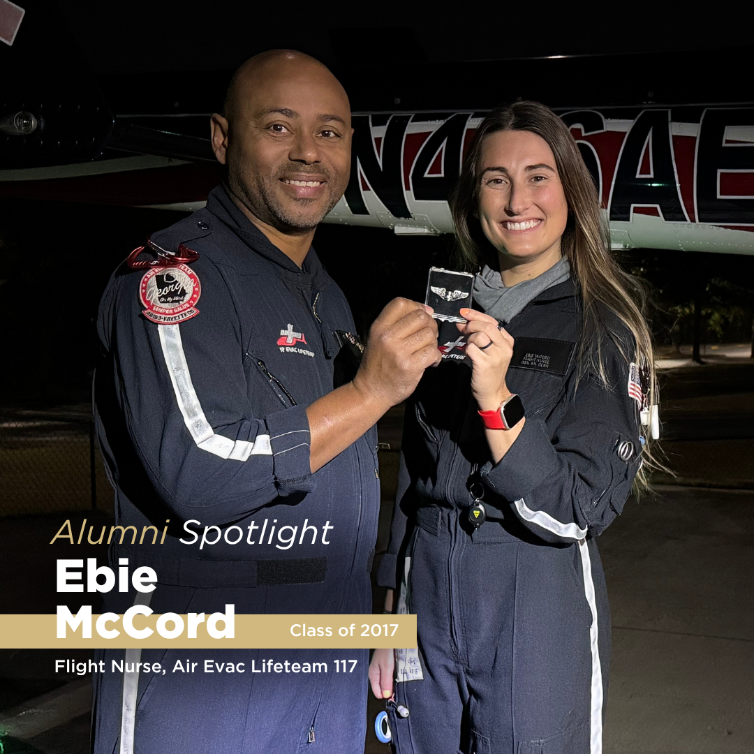 A smiling woman and man poses for a photo at night outside of a plane , featuring her in an alumni spotlight blog post.