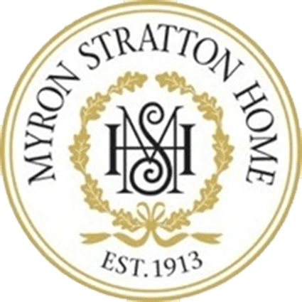 A circular logo featuring the text 'MYRON STRATTON HOME' around the top, with the initials 'MSH' in an ornate design at the center, and 'EST. 1913' at the bottom, all surrounded by a decorative wreath.