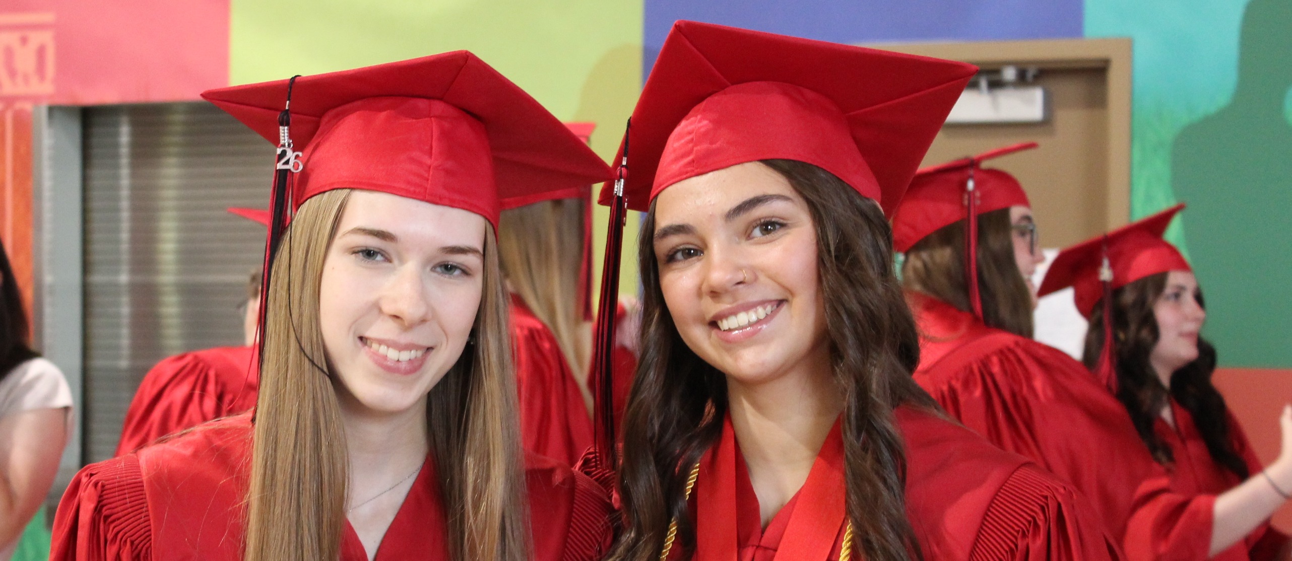 2 Students in Grad Uniform