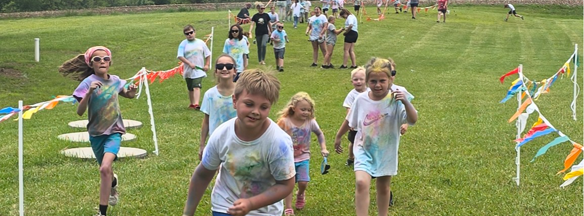 Image of students participating in a color run.
