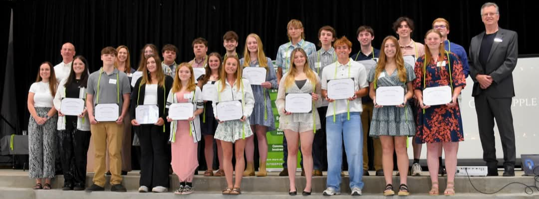 Group photo of students holding their Work Ethic Diplomas.