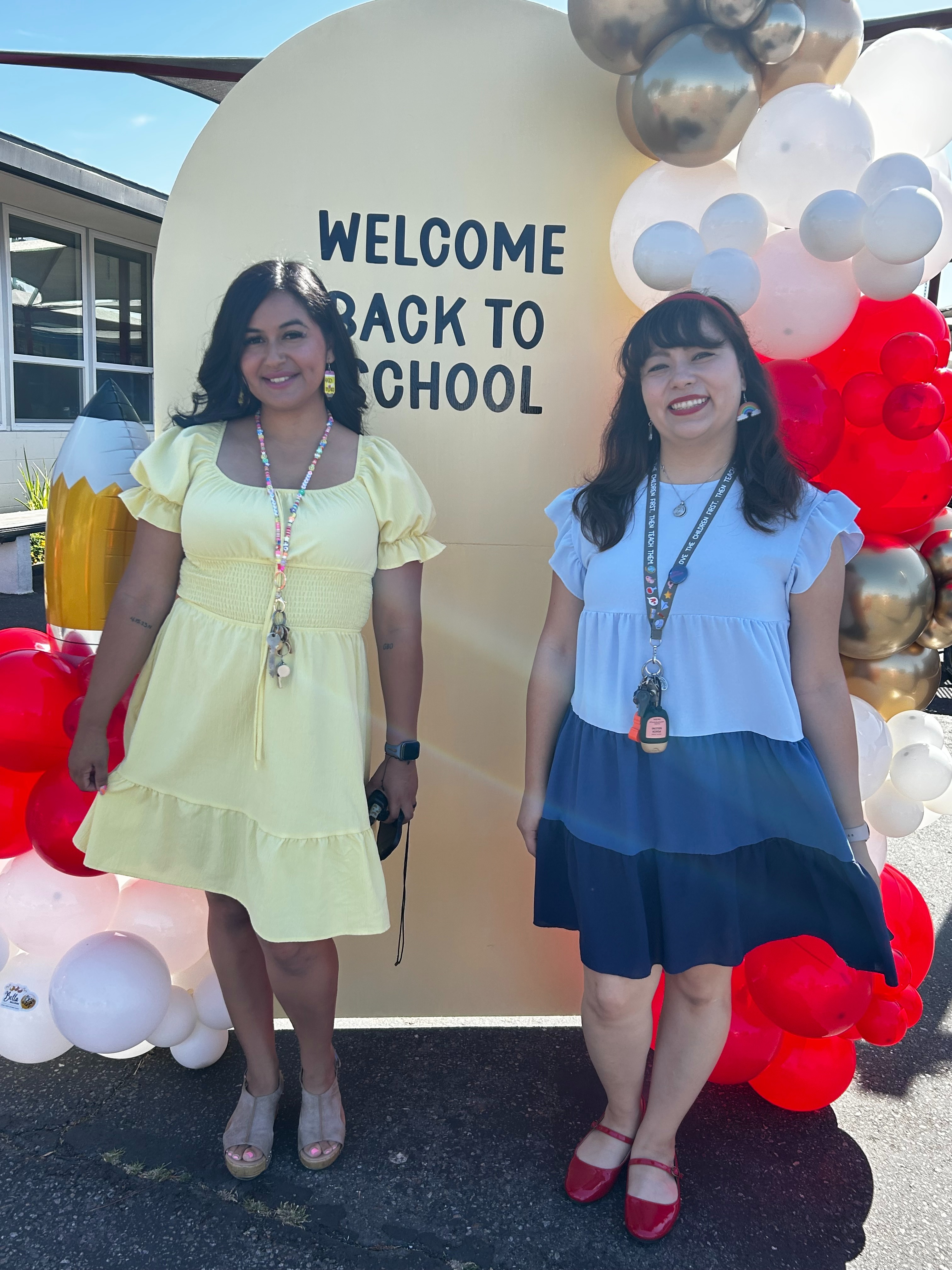 A sign labeled 'BUSINESS OFFICE' is mounted on a wall next to a textured artwork, with a doorway leading to another room in the background.