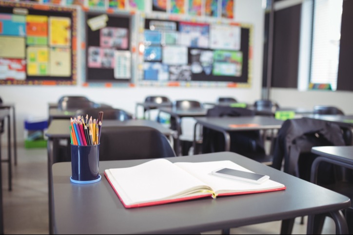 empty classroom with the focus on a student desk