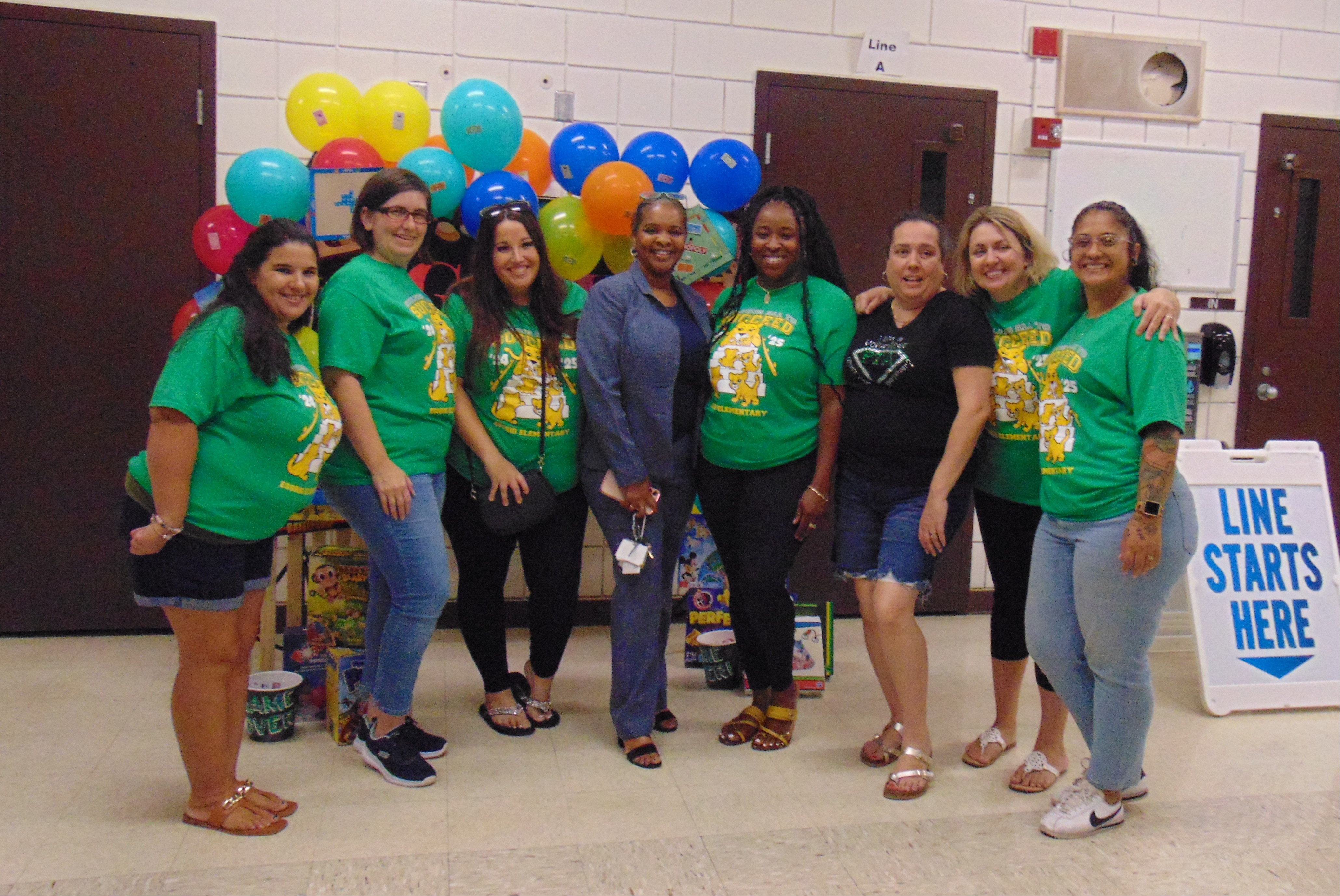 PTA members and Principal  at a school event.