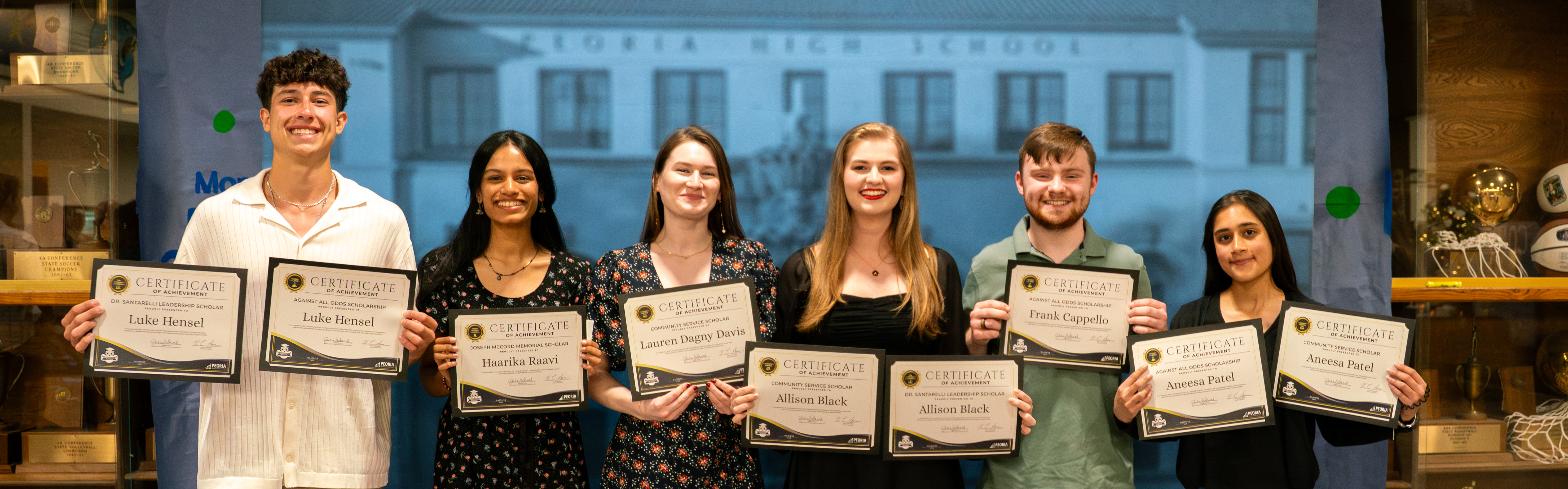 Liberty High School scholarship recipients holding their certificates