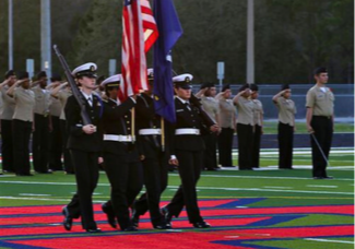 The Freedom NJROTC presents the colors at a home football game