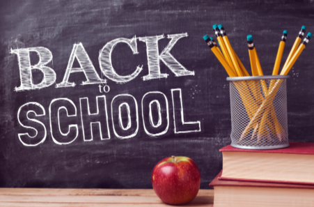 chalkboard with a picture of a cup filled with pencils on top of books next to an apple. Text says Back to School