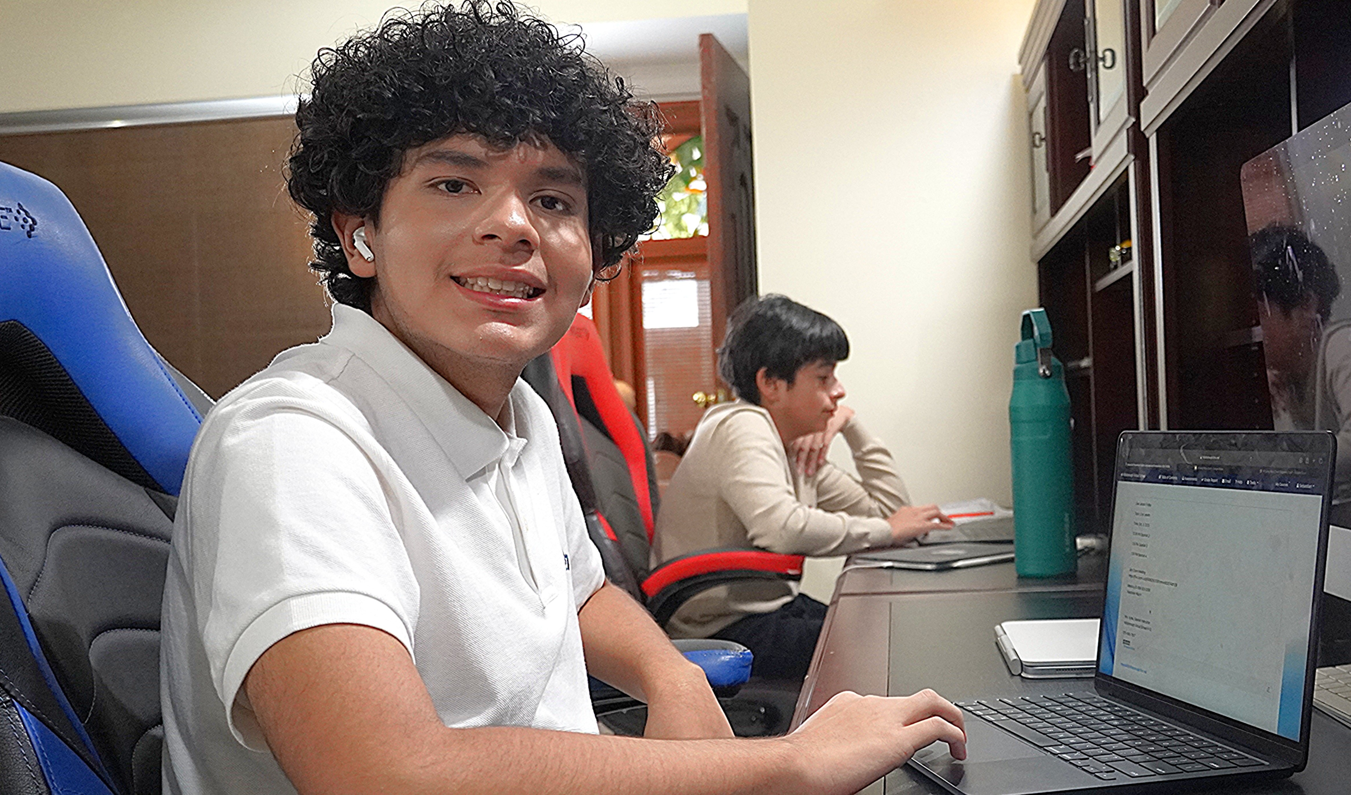 Students learning virtually on a computer