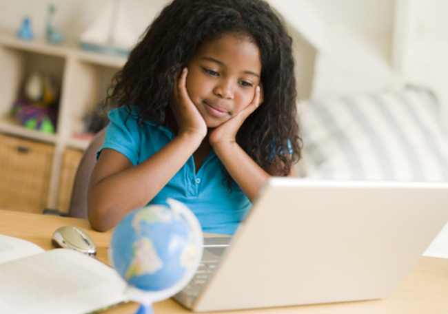 young student on laptop at home