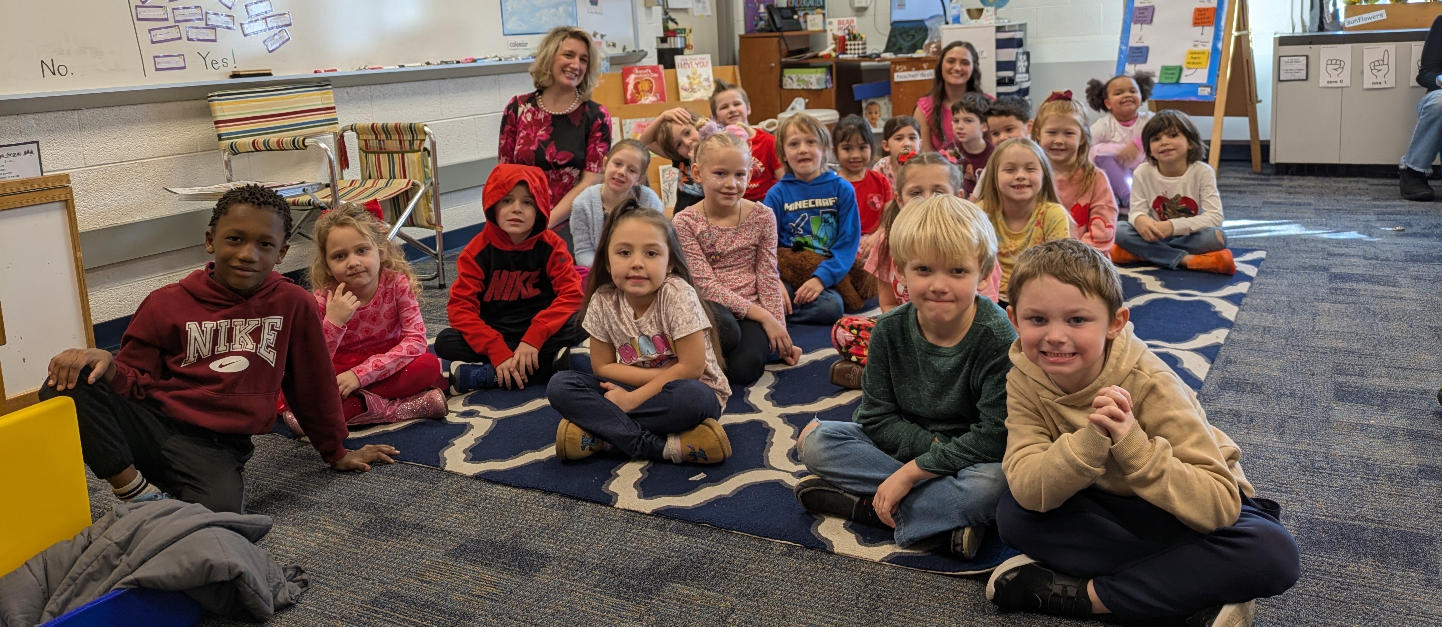 Mrs. Beckman sitting with her students