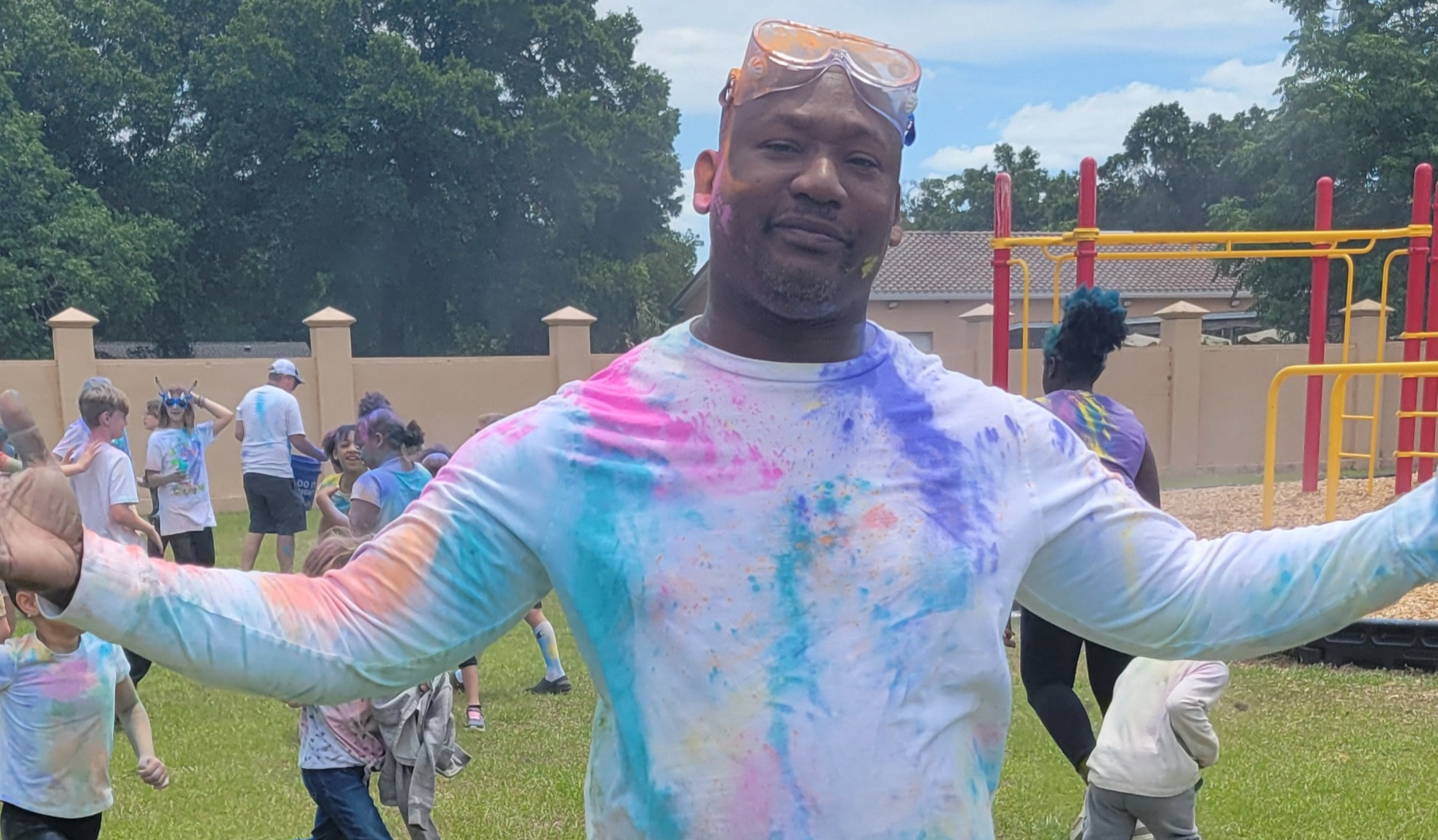 Mr. Mathurin covered in coloed powder at out Color Run!