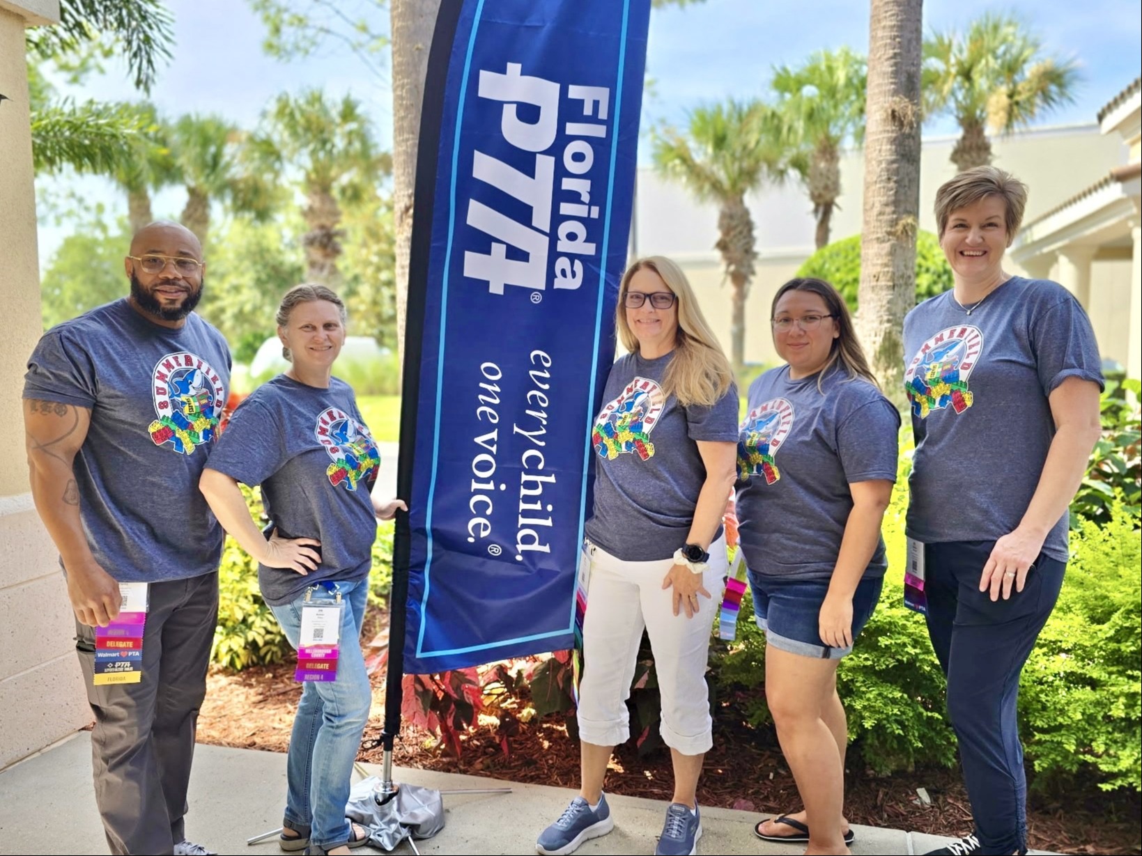 5 of Summerfield's PTA members posing in front of a Florida PTA banner