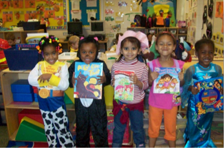 Students dressed as their favorite book character while holding the book.