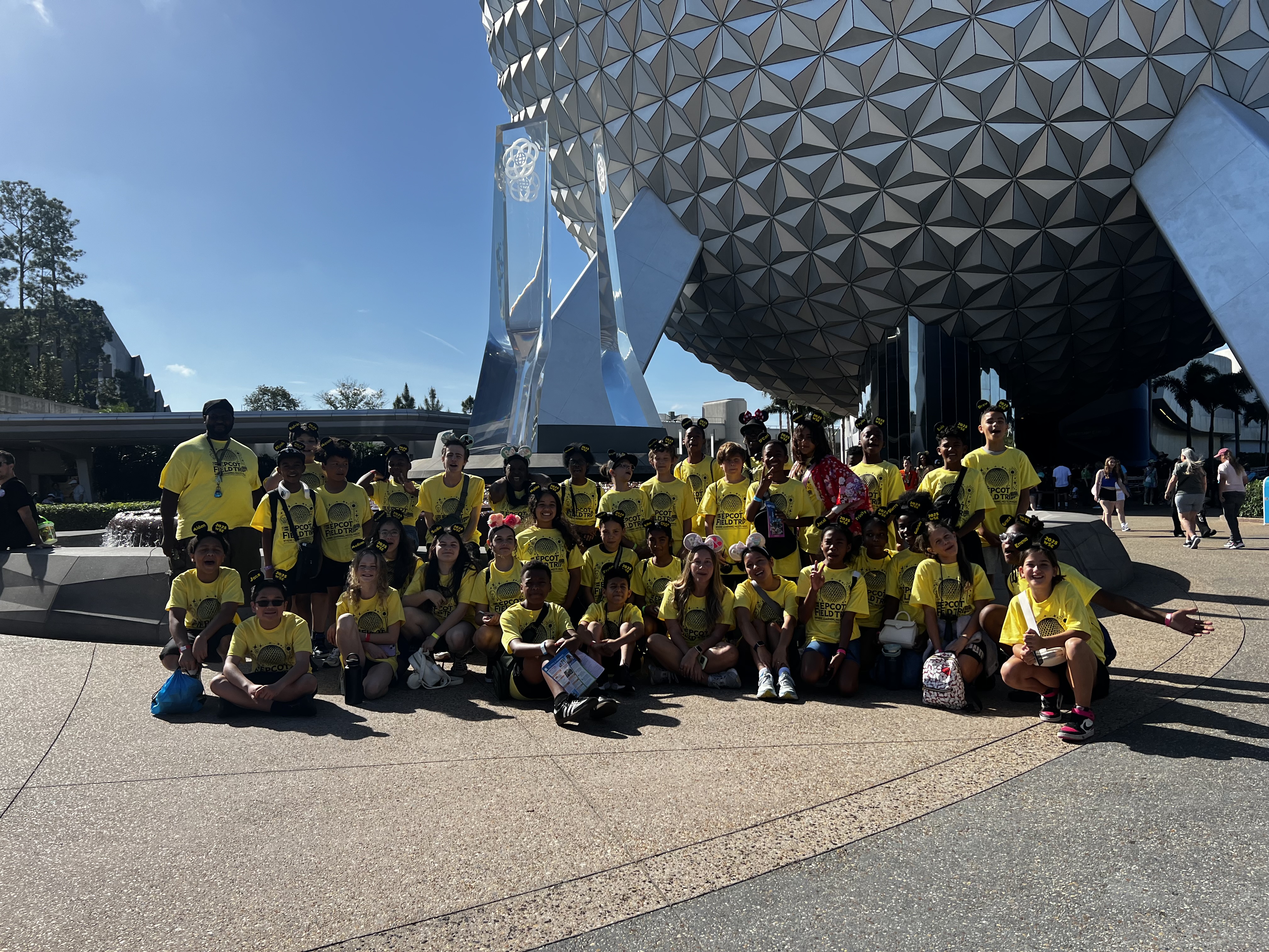 5th grade students at Epcot in front of the Epcot ball