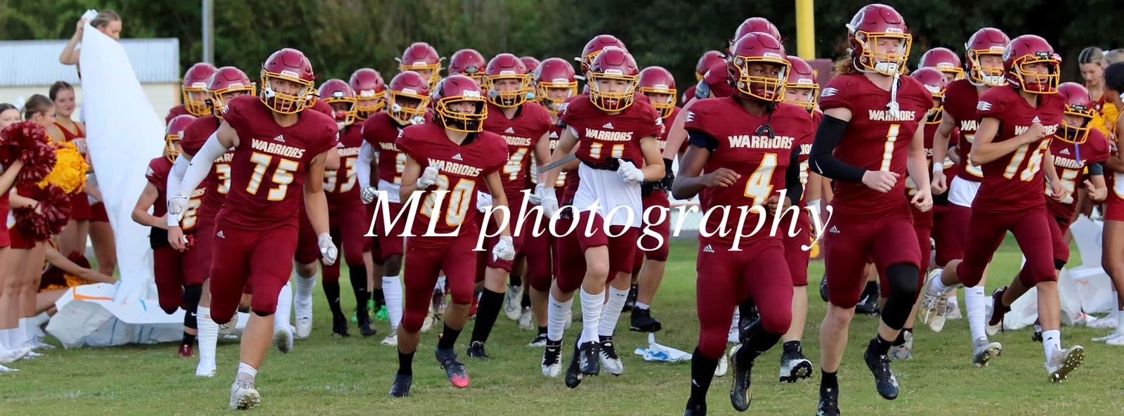 football team runs onto the field