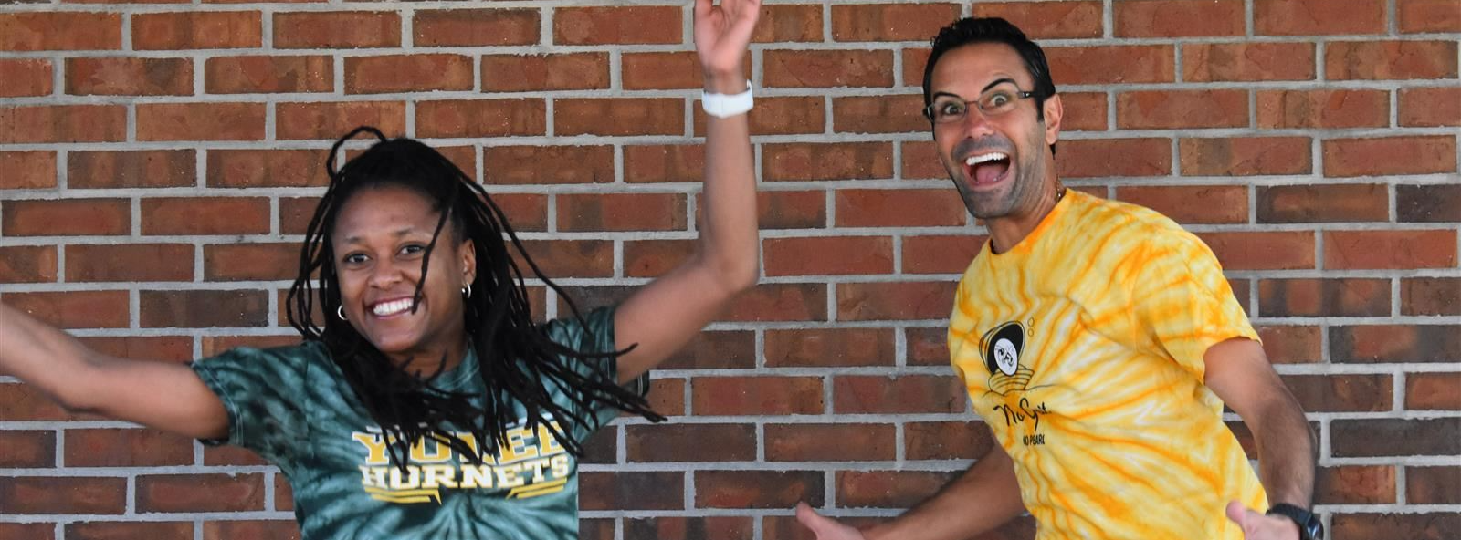 teachers jump and smile
