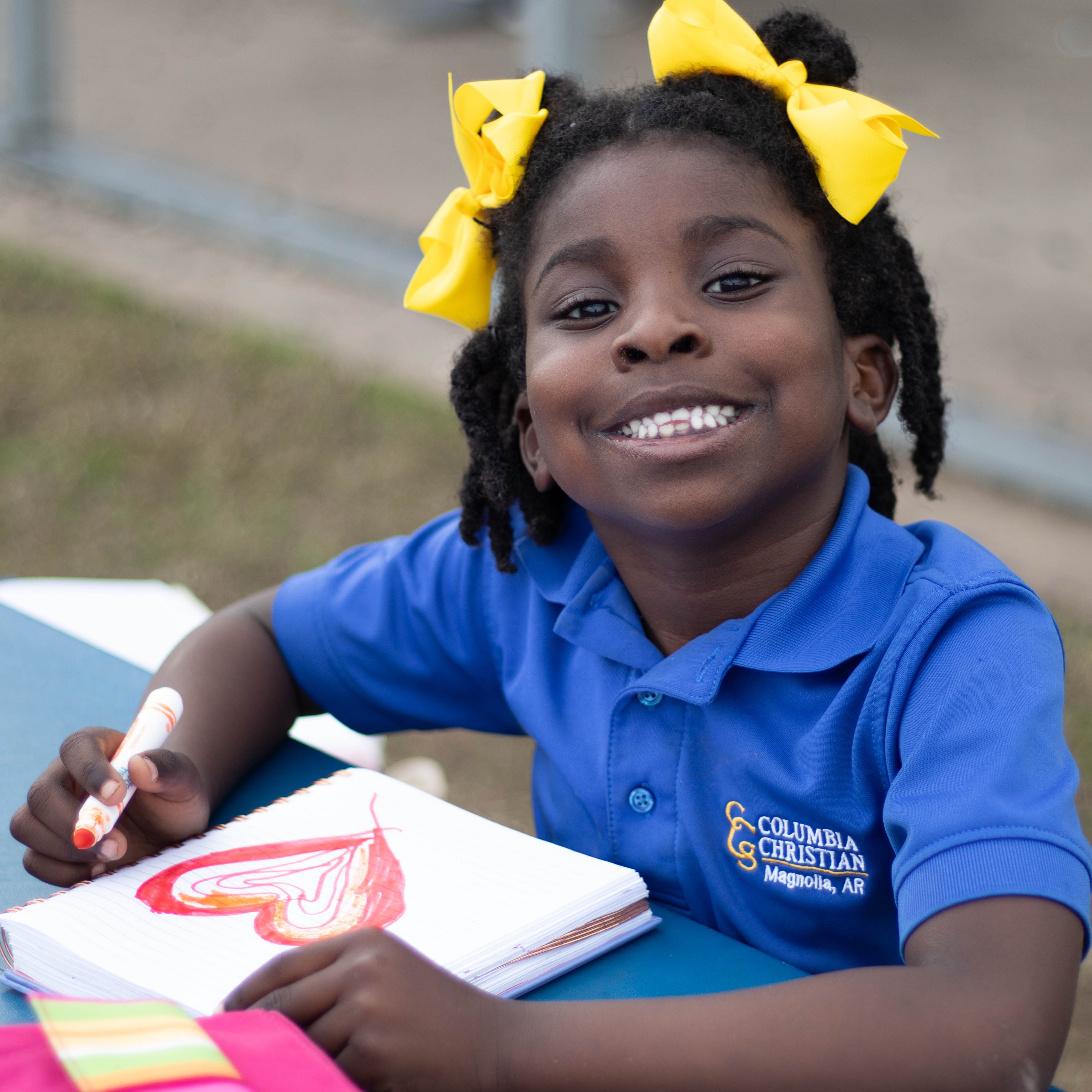 Columbia Christian Academy student smiling at the camera