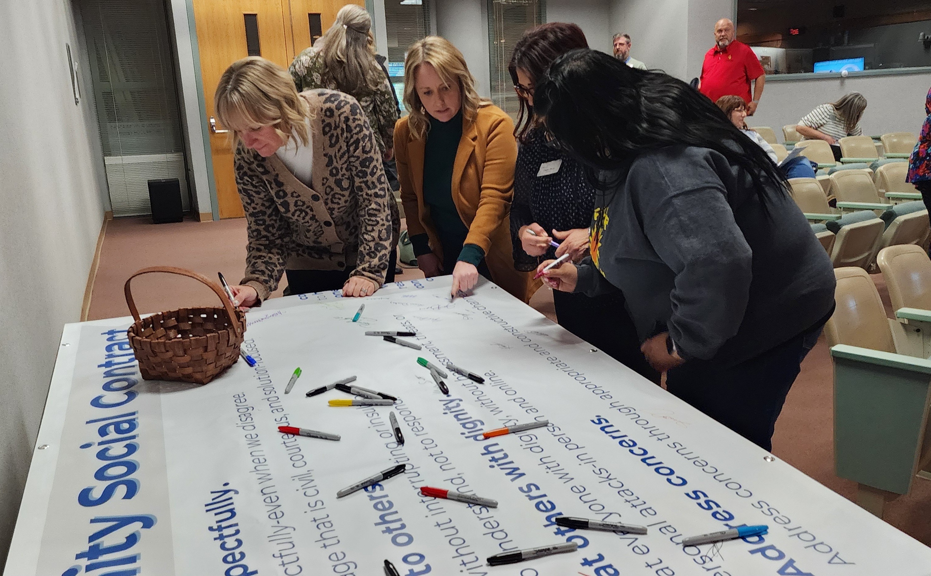 People signing social contract