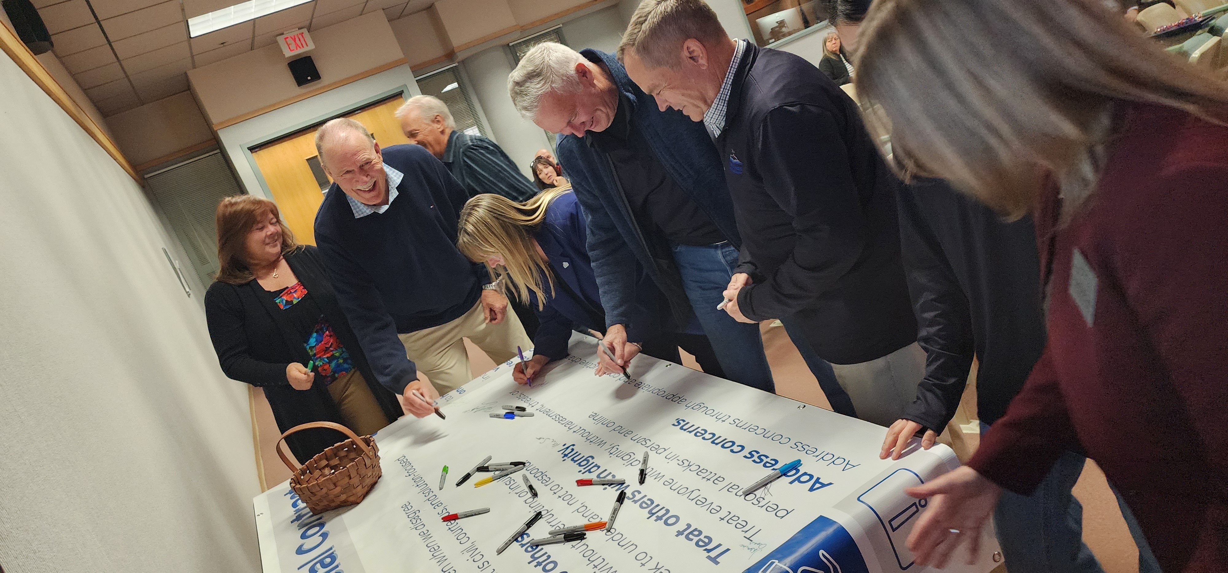 School Board Members signing social contract