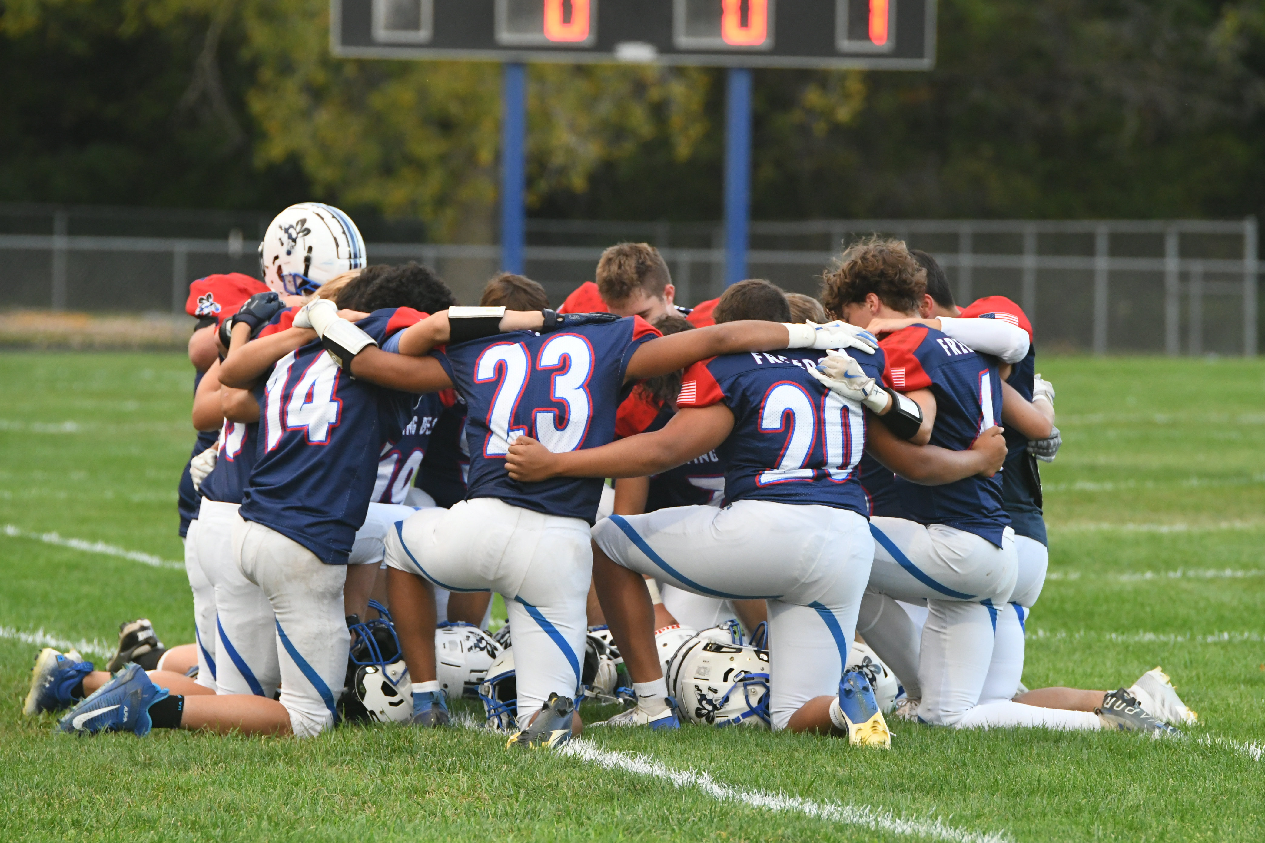 Football team in huddle