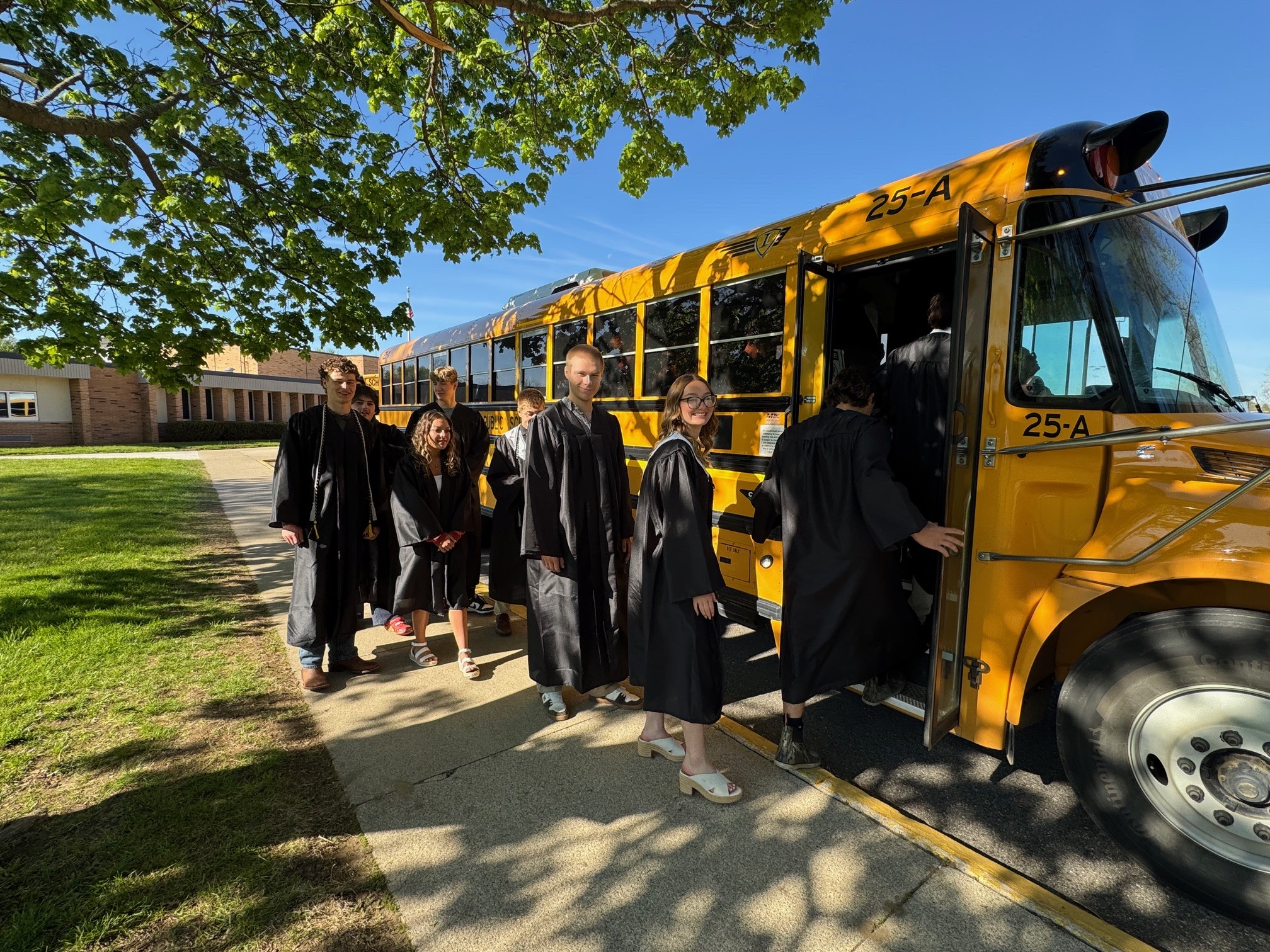 Grads Boarding Bus