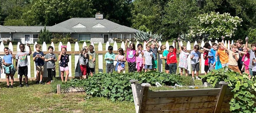 Group of students in a line in the garden