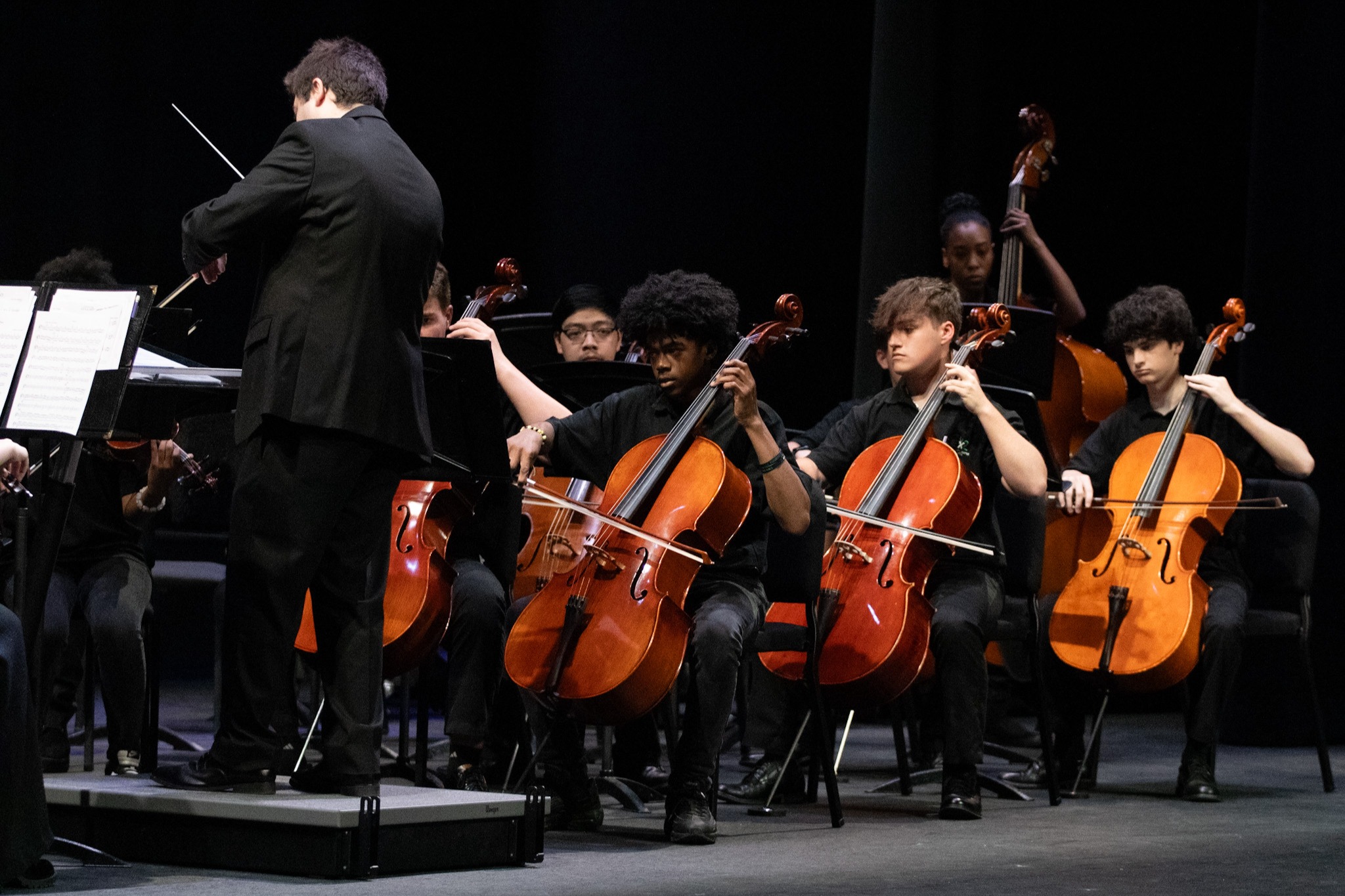 A picture of orchestra students playing a concert