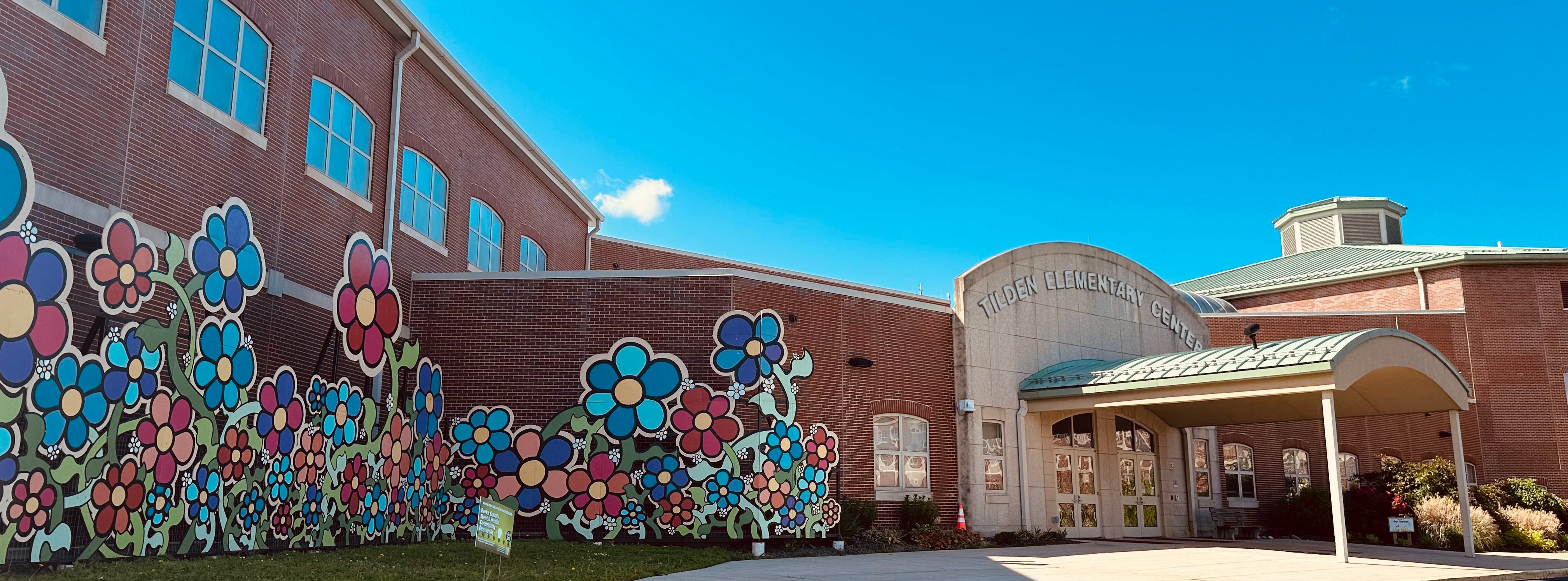 Tilden Front Entrance with Collage from 10,000 Flowers Project