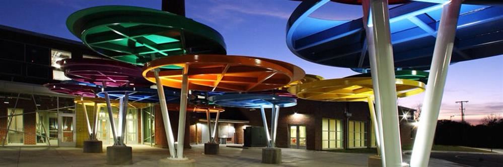 Explorer Academy image of entrance at night