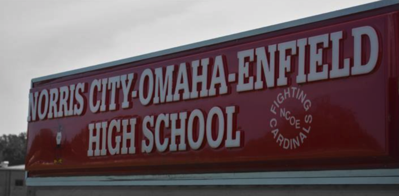 An image with a sign "Norris City-Omaha-Enfield High School".