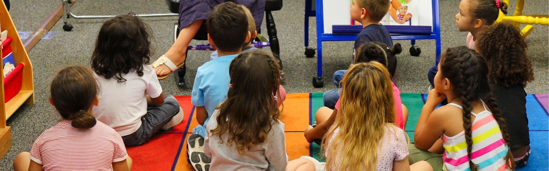 students in classroom hearing story