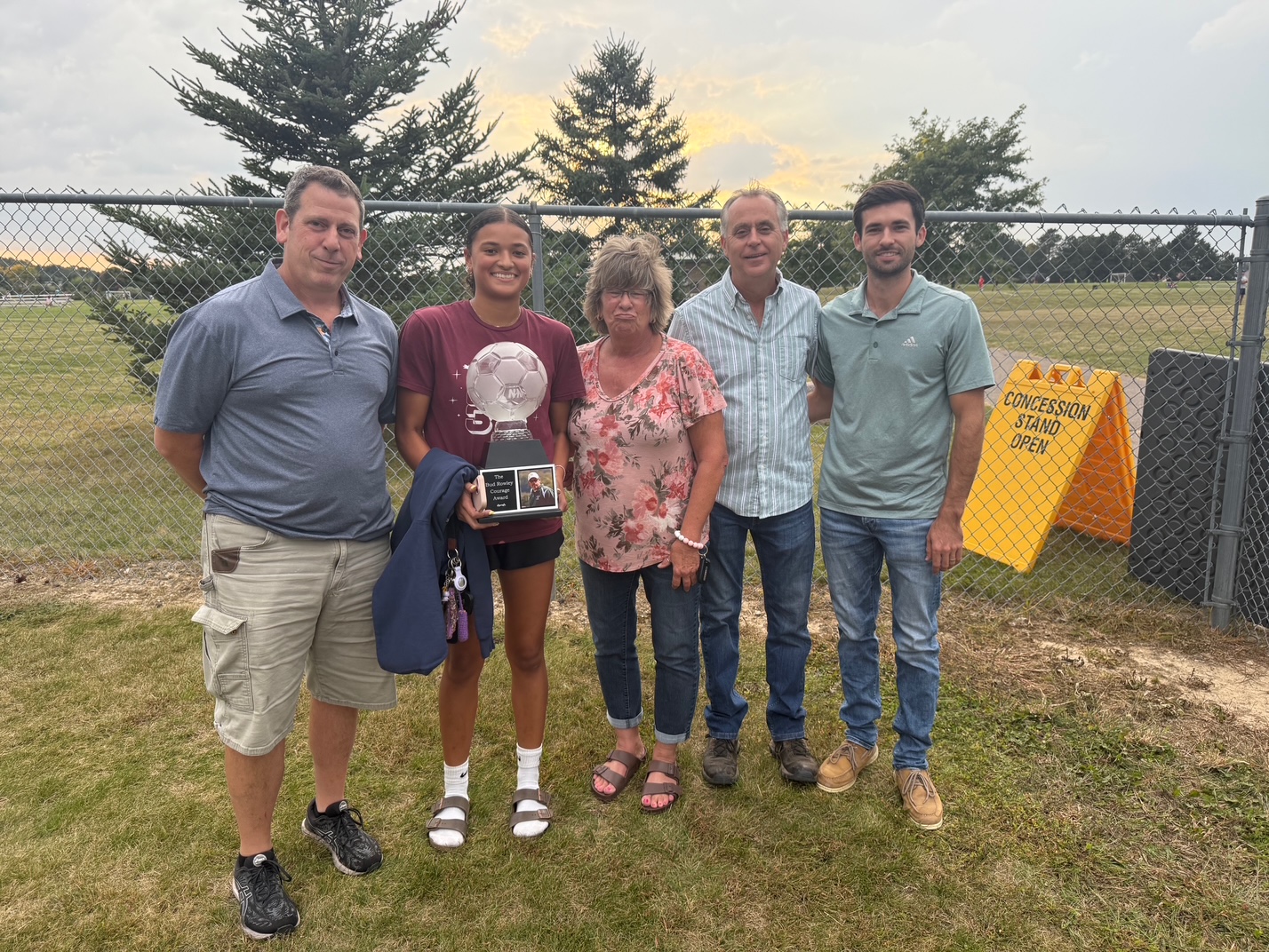 Rowley family posing after Lapeer soccer game