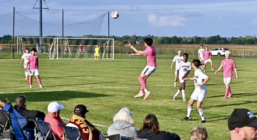 Boys high school soccer game action in Lapeer