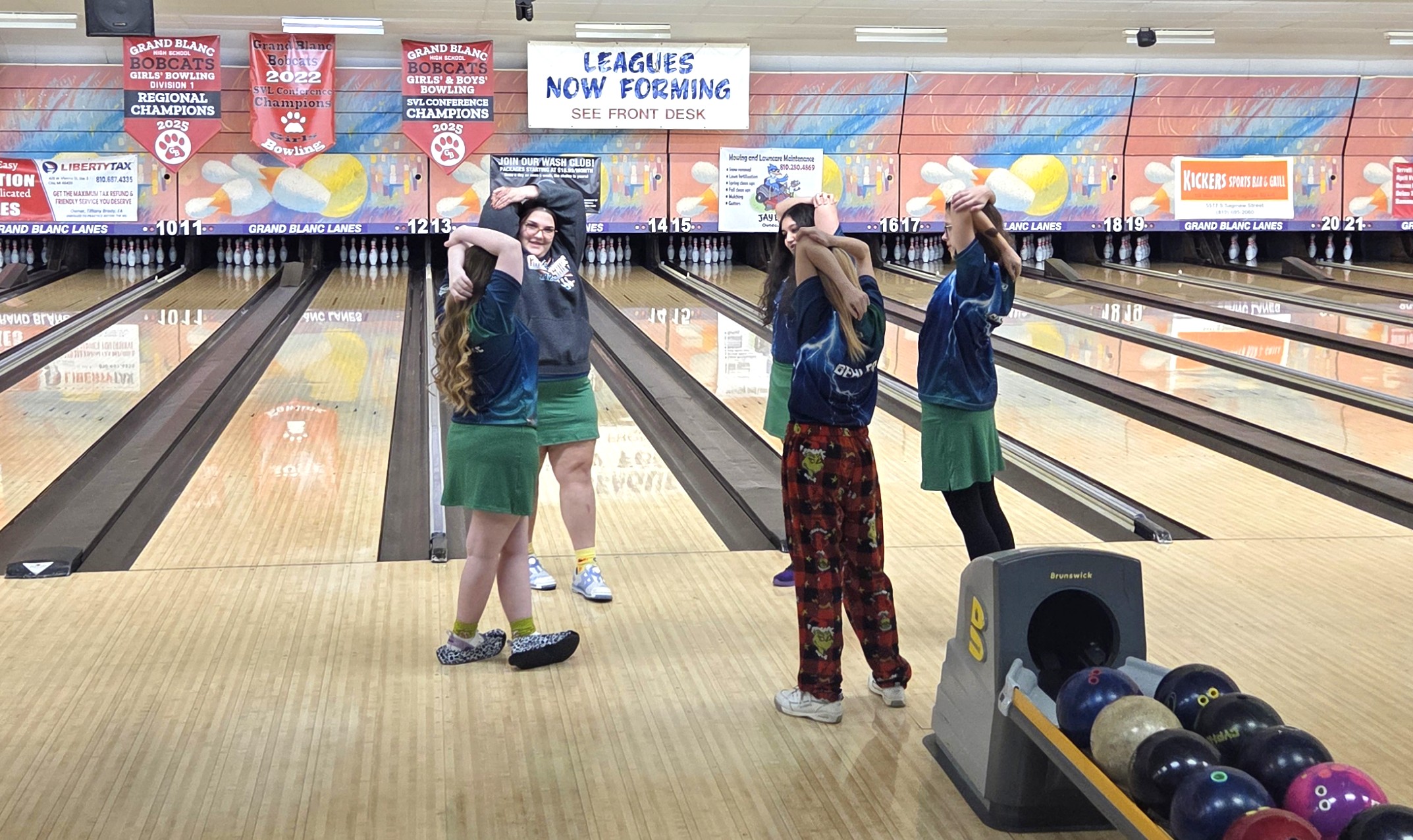 Lapeer girls bowling team stretching before a match