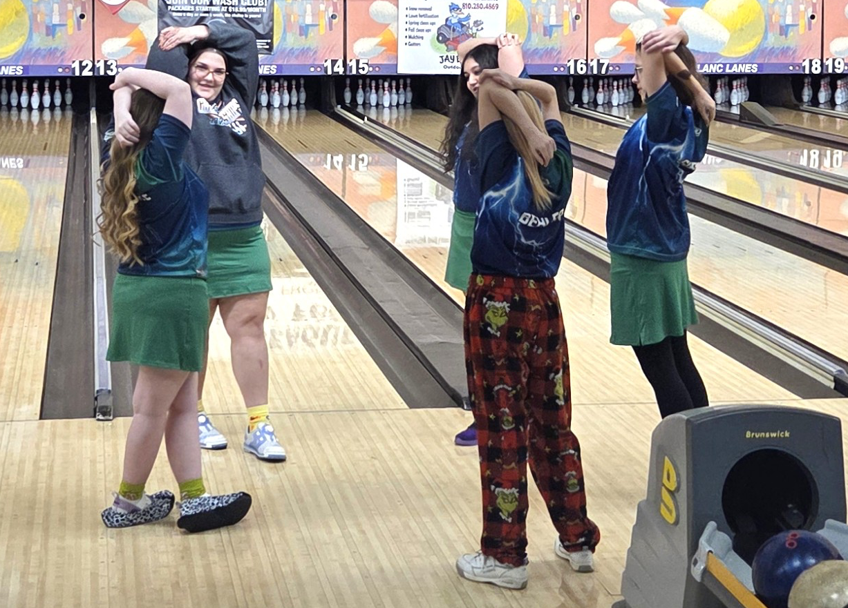 Lapeer girls bowling team stretching before a match