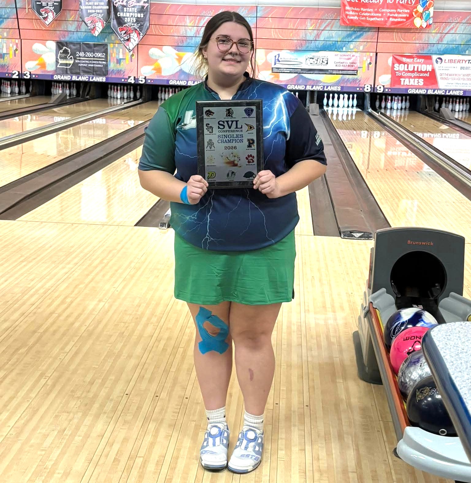 Isabellah Asaro holds up her plaque as SVL singles champion for the 2025-26 high school bowling season