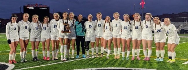 Lapeer girls soccer players celebrate the 2026 SVL championship
