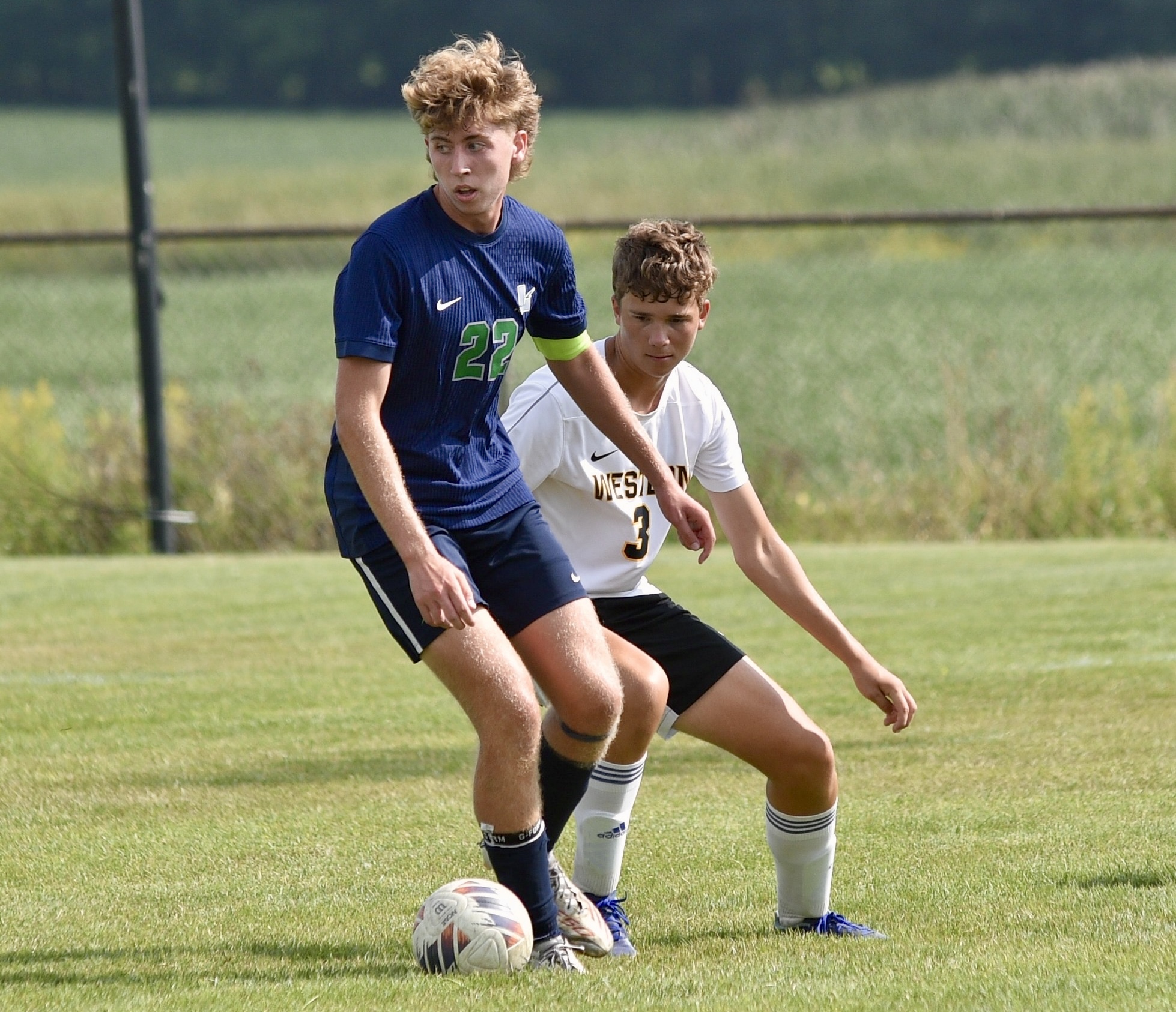 Lapeer boys soccer player playing the ball during a game in August 2026.