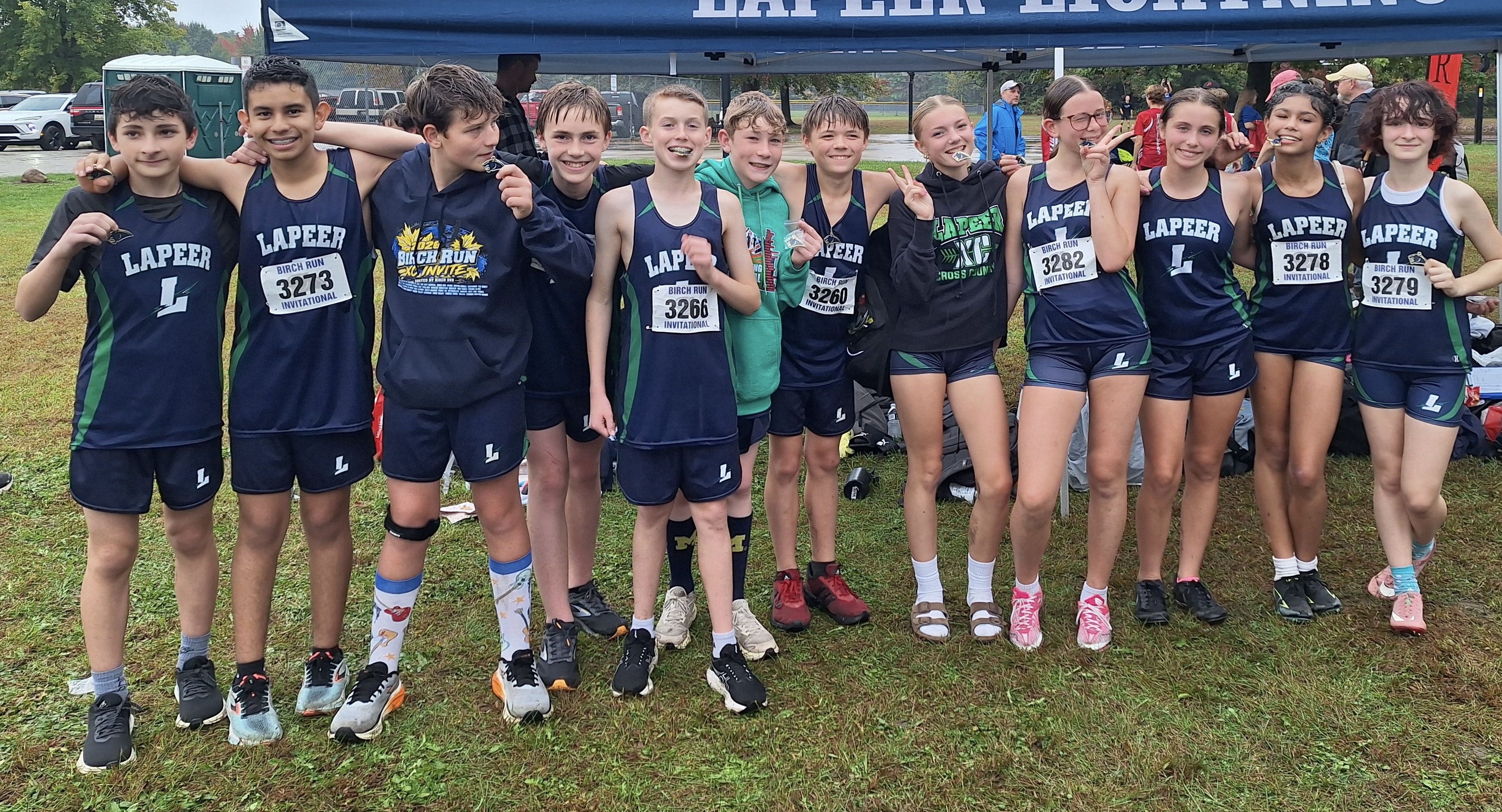 Lapeer middle school cross country teams celebrate wins and championships at the Birch Run Invitational on October 1, 2026.