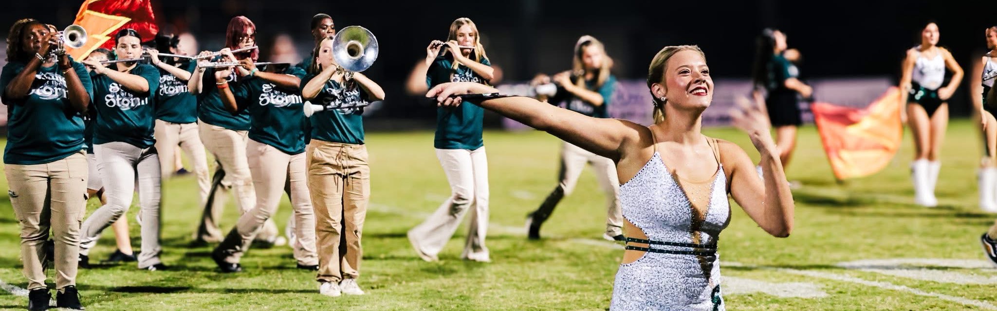 Majorette and band on field