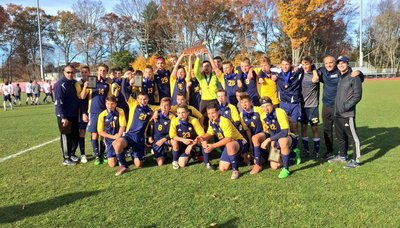 A photo of the soccer team holding an award