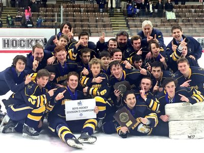 A photo of the hockey team with an award