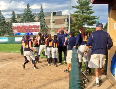 A photo of the softball team at a game