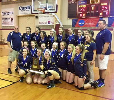 A photo of the basketball team holding an award