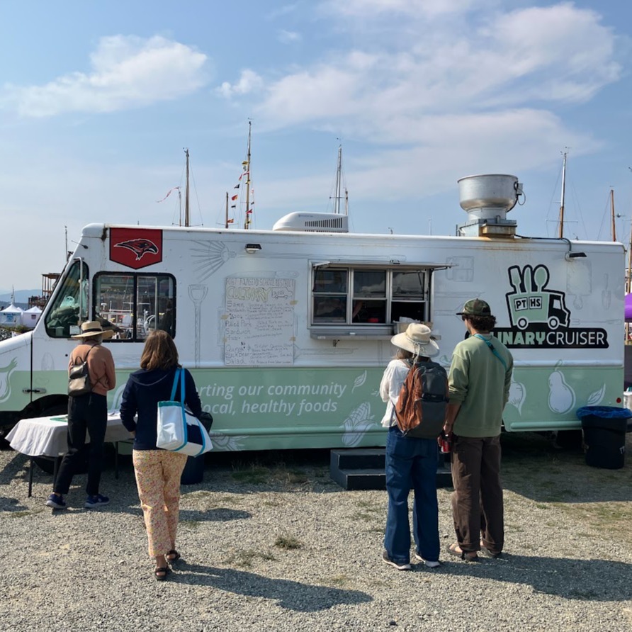 Culinary Cruiser @ Wooden boat with people waiting for food
