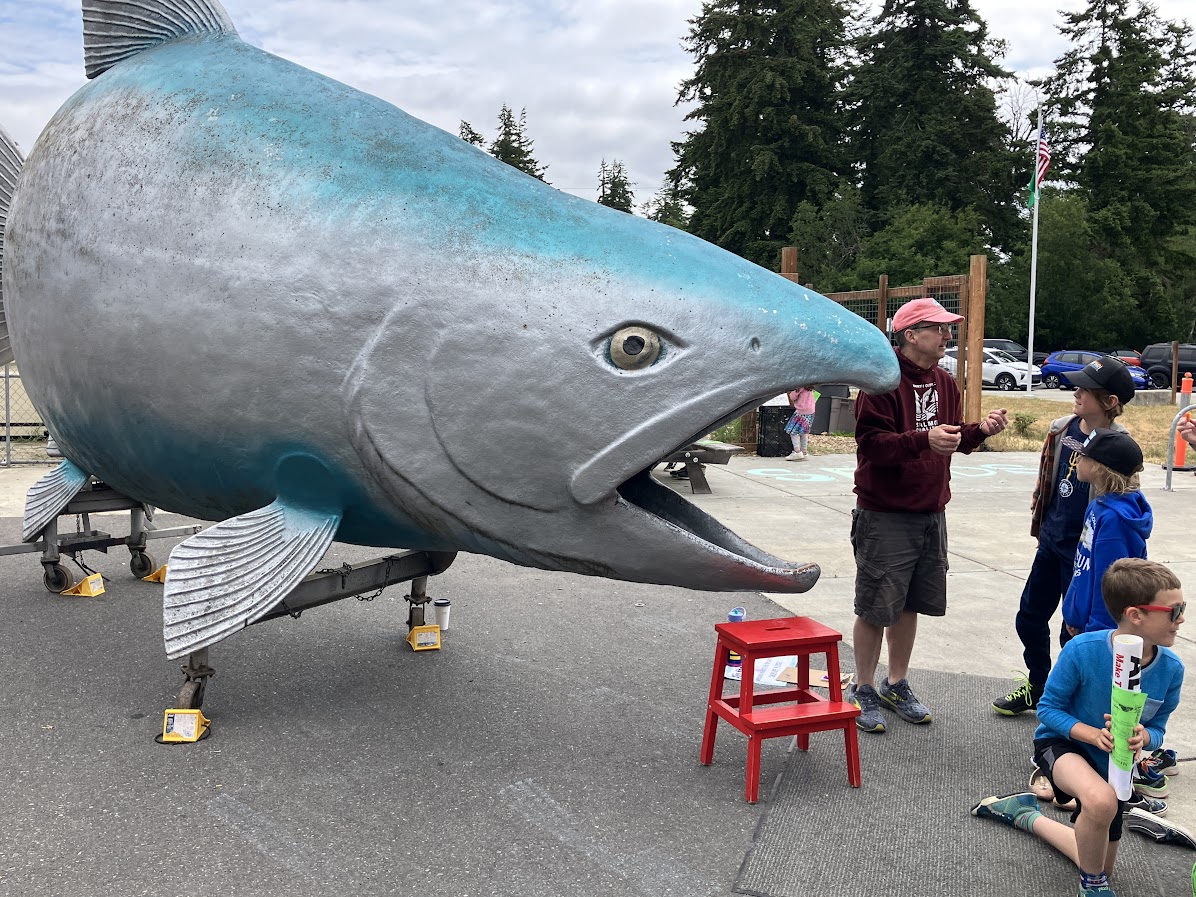 big fish with students and a teacher