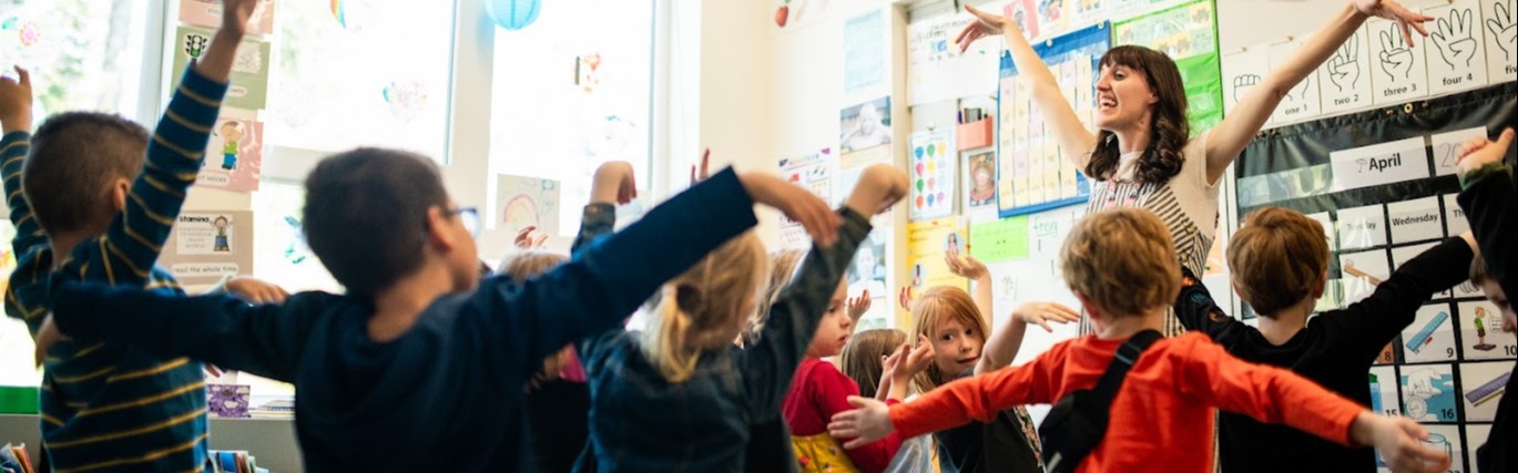kinder students learning  bright classroom 